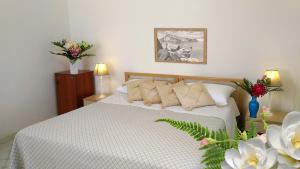 Postel nebo postele na pokoji v ubytování Hotel Villa Augustus