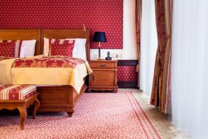 Postel nebo postele na pokoji v ubytování Arcadia Boutique Hotel