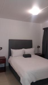 Voodi või voodid majutusasutuse Palmar Hotel toas