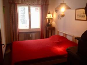 En eller flere senge i et værelse på Alloggio a Sestriere fronte piste