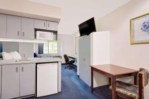 Televisor o centre d'entreteniment de Microtel Inn & Suites by Wyndham Hagerstown by I-81