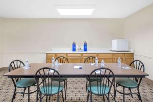 a conference room with a table and chairs at Microtel Inn & Suites by Wyndham Franklin in Franklin
