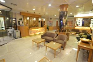 a lobby of a store with chairs and tables at Hotel Inter Istanbul in Istanbul