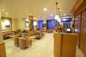 a lobby with a waiting room with chairs and a reception desk at Hotel Inter Istanbul in Istanbul