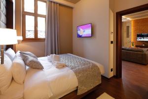 TV a/nebo společenská místnost v ubytování Hotel Passpartù Home Garni