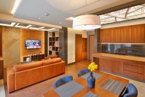 TV a/nebo společenská místnost v ubytování Hotel Passpartù Home Garni