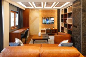 TV a/nebo společenská místnost v ubytování Hotel Passpartù Home Garni