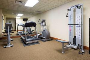 a gym with several treadmills and elliptical machines at Wingate by Wyndham Erlanger - Florence - Cincinnati South in Erlanger