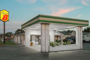 a shell gas station with a sign in front of it at Super 8 by Wyndham Sumter in Sumter