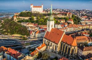 an aerial view of a city with a church at Arcadia Boutique Hotel in Bratislava