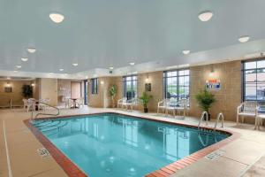 a large swimming pool in a hotel room at Super 8 by Wyndham Akron S/Green/Uniontown OH in Uniontown