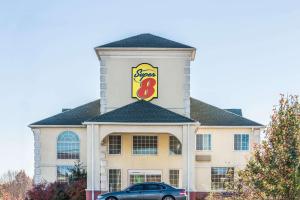 a building with a sign on the top of it at Super 8 by Wyndham Harrisburg Hershey North in Harrisburg