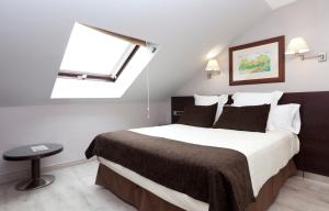 Posteľ alebo postele v izbe v ubytovaní Hotel San Juan de los Reyes