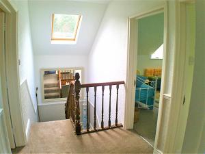 a staircase in a home with a stair railing at Happy Seaside Days in Combe Martin, Devon in Combe Martin