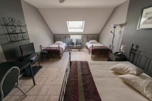 Postel nebo postele na pokoji v ubytování Auberge de la Lesse