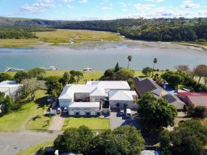 an aerial view of a large house with a lake at Kowie River Guest House in Port Alfred