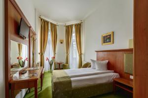 Postel nebo postele na pokoji v ubytování Hotel Palace