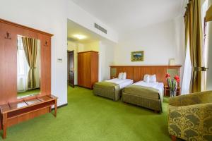 Postel nebo postele na pokoji v ubytování Hotel Palace