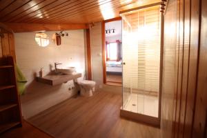 a bathroom with a sink and a toilet and a mirror at Valle y Mar, Casa de Huéspedes in La Herradura +37 photos