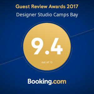 Ett certifikat, pris eller annat dokument som visas upp på Designer Studio Camps Bay