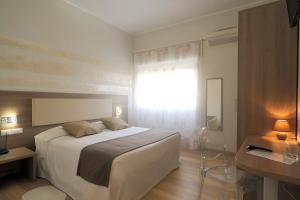 Postel nebo postele na pokoji v ubytování Albergo Anita Alassio