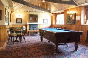 a billiard room with a pool table in it at Radstock Hotel near Bath in Radstock