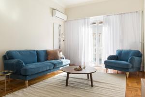 A seating area at Chic Flat in the Heart of Athens by UPSTREET