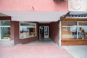 an empty store front with windows and a door at Vitosha Apartments in Sofia