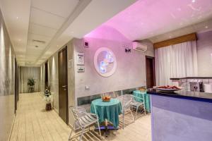 a restaurant with a table and chairs in a room at Buonarroti Suite in Rome