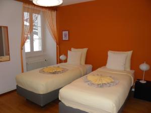 Postel nebo postele na pokoji v ubytování Auberge au Cavalier