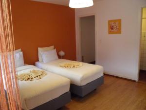 Postel nebo postele na pokoji v ubytování Auberge au Cavalier