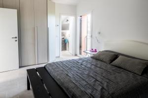 Postel nebo postele na pokoji v ubytování B&B - Uva Residence