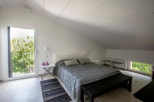 Postel nebo postele na pokoji v ubytování B&B - Uva Residence