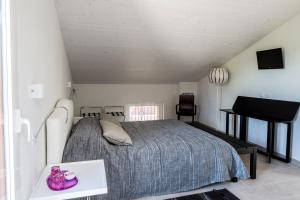 Postel nebo postele na pokoji v ubytování B&B - Uva Residence