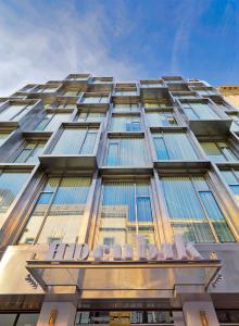 
a tall building with windows and a blue sky at H10 Cubik 4* Sup in Barcelona
