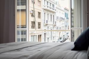 Posteľ alebo postele v izbe v ubytovaní Acropolis Core Bright & Modern Apartment by UPSTREET