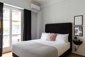 Posteľ alebo postele v izbe v ubytovaní Acropolis Core Bright & Modern Apartment by UPSTREET