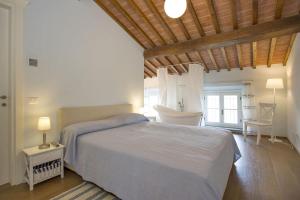 Posteľ alebo postele v izbe v ubytovaní Santo Stefano 10 by Salogi Villas