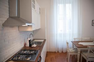 A kitchen or kitchenette at St Paul House Boutique & Apartment