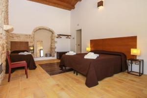 A bed or beds in a room at Agriturismo Le Chiuse di Guadagna