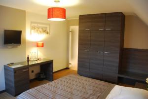 Postel nebo postele na pokoji v ubytování Hotel Rubens