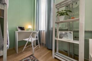 a room with a desk, chair and a window at Hostel Mayakovsky in Moscow