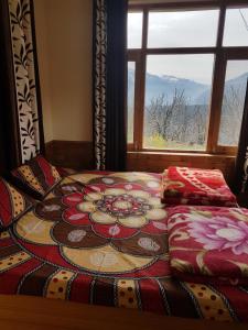 Postel nebo postele na pokoji v ubytování Sunface Homestay