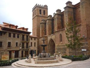 a large building with a fountain in front of it at franlau in Mora de Rubielos