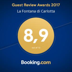 a yellow circle with the words guest review awards la centanza dh cantori at La Fontana di Carlotta in Rome