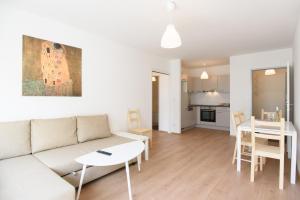 a living room with a couch and a table at Central Living Apartments - Reumannplatz in Vienna