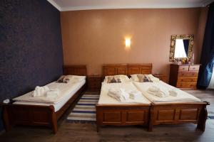 A bed or beds in a room at Hotel Bristol