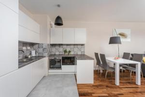 Kuchyň nebo kuchyňský kout v ubytování Chill Apartments City Link