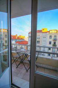 a view of a balcony from a window at Residencial Lord in Lisbon