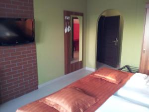 Letto o letti in una camera di Hotel Vinopa